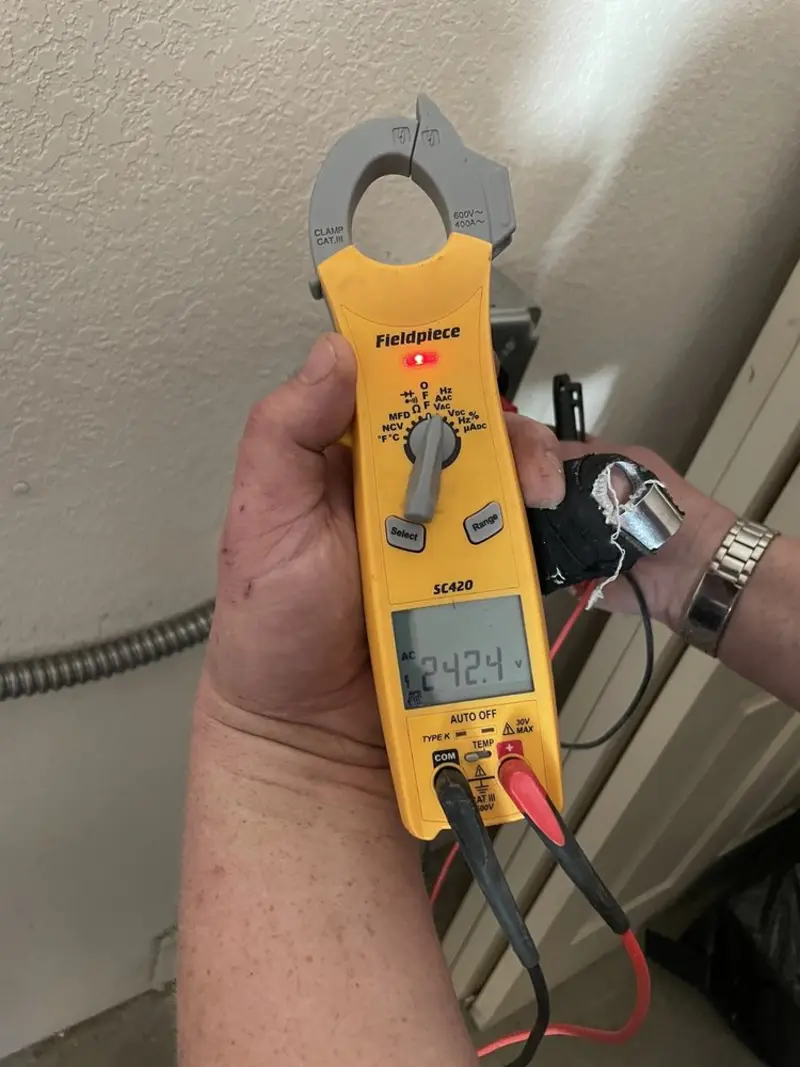 Voltage testing with clamp meter during Outlet Installation in Franklin Park